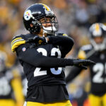 Joe Haden #23 of the Pittsburgh Steelers celebrates a stop on fourth down in the fourth quarter to end the game at Heinz Field on December 19, 2021 in Pittsburgh, Pennsylvania.