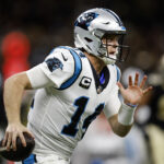 Sam Darnold #14 of the Carolina Panthers runs with the ball in the first quarter of the game against the New Orleans Saints at Caesars Superdome on January 02, 2022 in New Orleans, Louisiana.