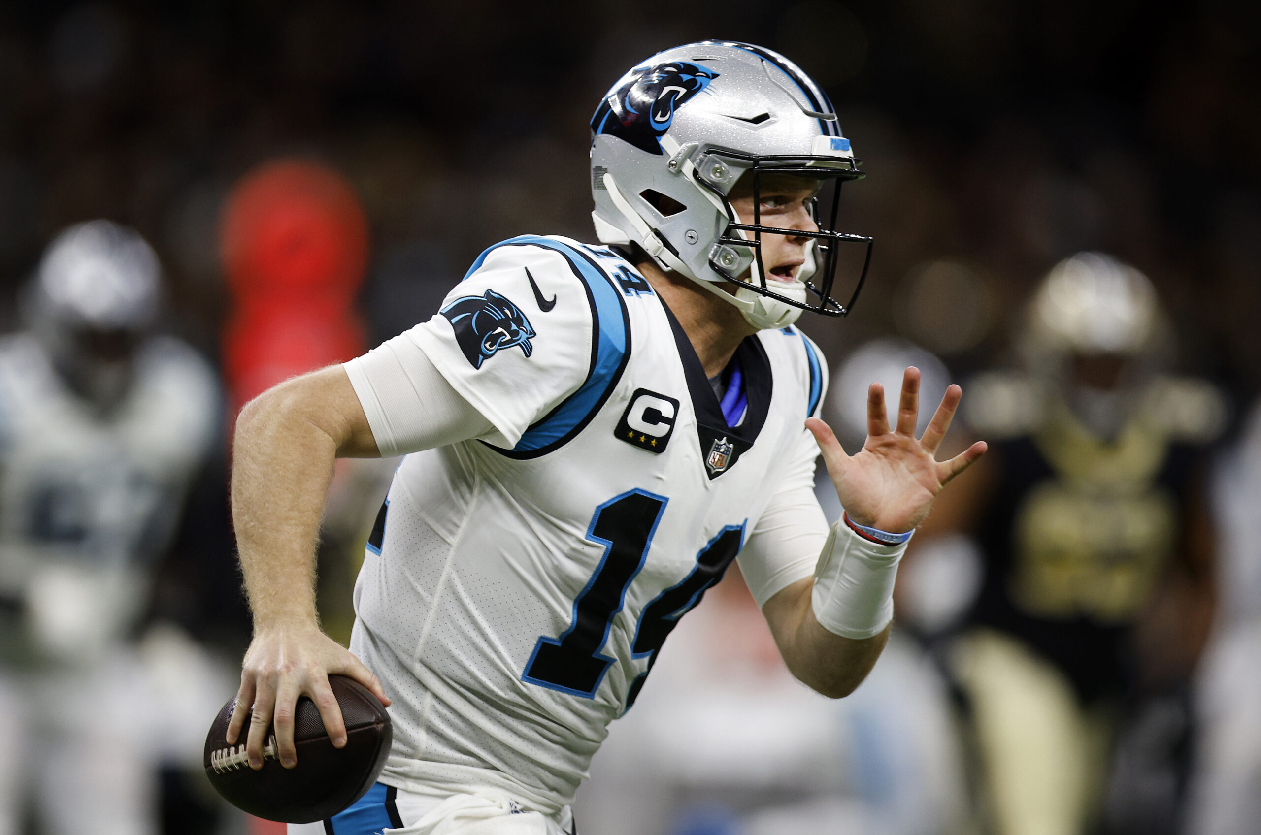 Sam Darnold #14 of the Carolina Panthers runs with the ball in the first quarter of the game against the New Orleans Saints at Caesars Superdome on January 02, 2022 in New Orleans, Louisiana.