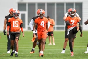 Joshua Dobbs #15, Deshaun Watson #4 and Jacoby Brissett #7 of the Cleveland Browns warm up during the Cleveland Browns OTAs at CrossCountry Mortgage Campus on May 25, 2022 in Berea, Ohio.