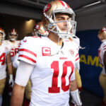 Jimmy Garoppolo #10 of the San Francisco 49ers prepares to take the field with teammates before the NFC Championship Game against the Los Angeles Rams at SoFi Stadium on January 30, 2022 in Inglewood, California.