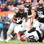 Nick Chubb #24 of the Cleveland Browns runs the ball during the third quarter against the Cincinnati Bengals at FirstEnergy Stadium on January 09, 2022 in Cleveland, Ohio.