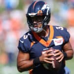 Quarterback Russell Wilson #3 of the Denver Broncos practices with his team during training camp at UCHealth Training Center on July 27, 2022 in Englewood, Colorado.