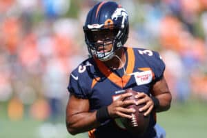 Quarterback Russell Wilson #3 of the Denver Broncos practices with his team during training camp at UCHealth Training Center on July 27, 2022 in Englewood, Colorado.