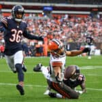 Anthony Schwartz #10 of the Cleveland Browns attempts to catch a pass against Greg Stroman Jr. #39 and DeAndre Houston-Carson #36 of the Chicago Bears during the first half of a preseason game at FirstEnergy Stadium on August 27, 2022 in Cleveland, Ohio.