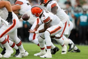 Deshaun Watson #4 of the Cleveland Browns fumbles a snap against the Jacksonville Jaguars during a football game at TIAA Bank Field on August 12, 2022 in Jacksonville, Florida.