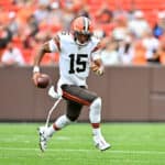 Quarterback Joshua Dobbs #15 of the Cleveland Browns runs for a first down during the first quarter of a preseason game against the Philadelphia Eagles at FirstEnergy Stadium on August 21, 2022 in Cleveland, Ohio.