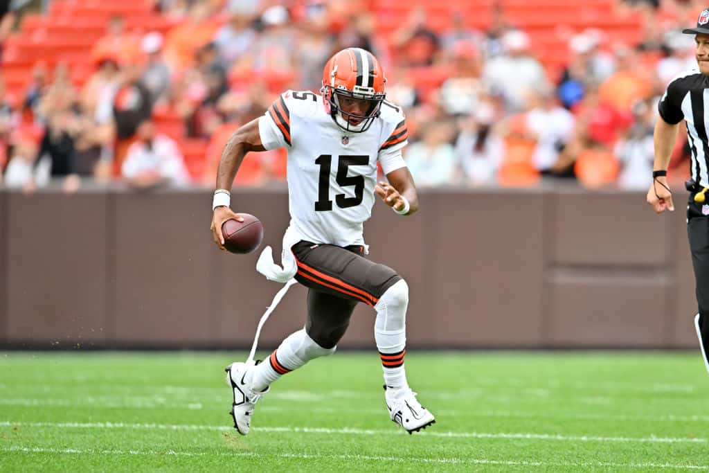 Quarterback Joshua Dobbs #15 of the Cleveland Browns runs for a first down during the first quarter of a preseason game against the Philadelphia Eagles at FirstEnergy Stadium on August 21, 2022 in Cleveland, Ohio.