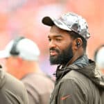 Quarterbacks Deshaun Watson #4 and Jacoby Brissett #7 of the Cleveland Browns talk on the sidelines during the fourth quarter of a preseason game against the Philadelphia Eagles at FirstEnergy Stadium on August 21, 2022 in Cleveland, Ohio. The Eagles defeated the Browns 21-20.