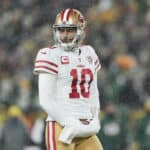 Quarterback Jimmy Garoppolo #10 of the San Francisco 49ers looks toward the sidelines during the 4th quarter of the NFC Divisional Playoff game against the Green Bay Packers at Lambeau Field on January 22, 2022 in Green Bay, Wisconsin.