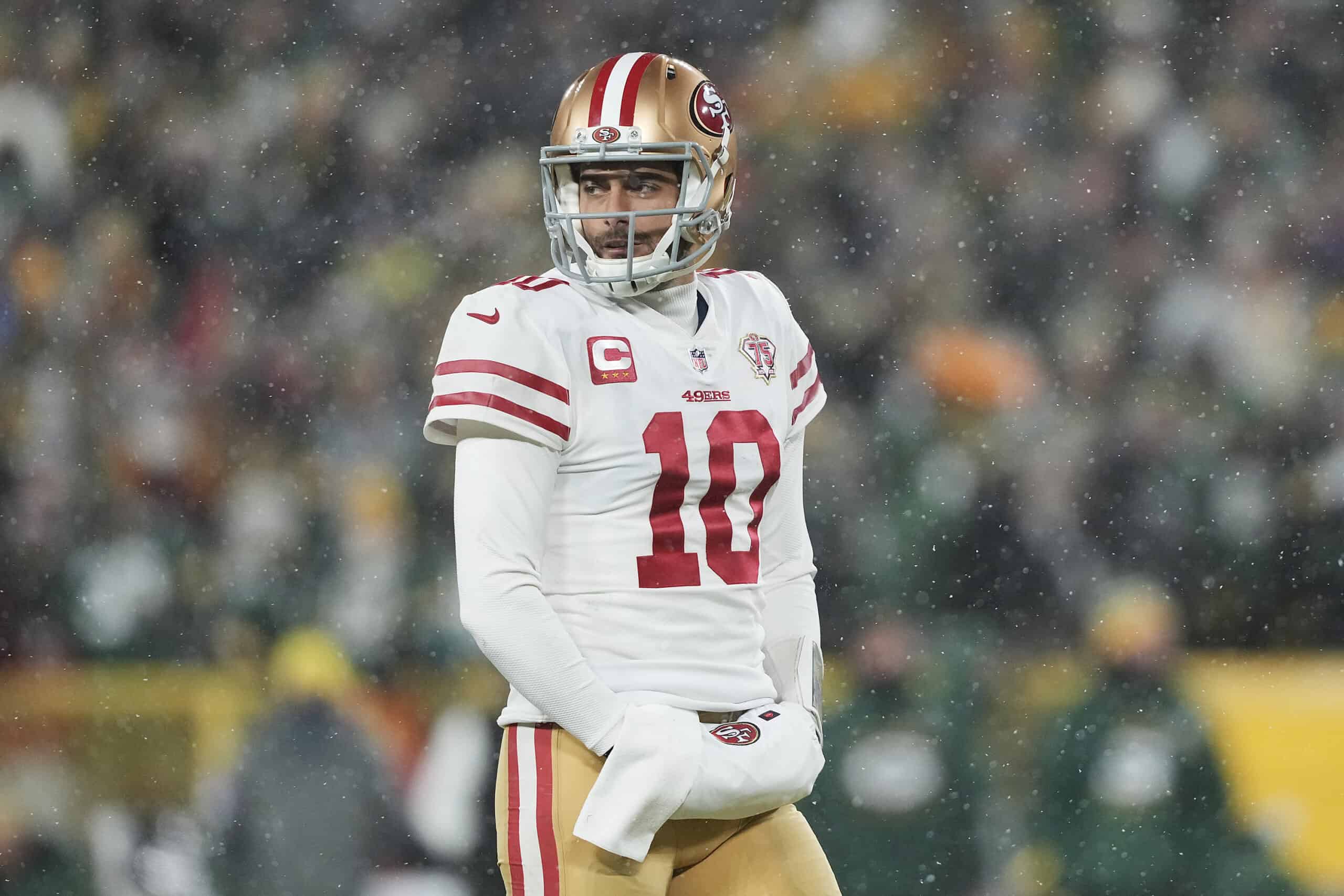 Quarterback Jimmy Garoppolo #10 of the San Francisco 49ers looks toward the sidelines during the 4th quarter of the NFC Divisional Playoff game against the Green Bay Packers at Lambeau Field on January 22, 2022 in Green Bay, Wisconsin.