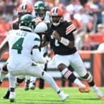 Jacoby Brissett #7 of the Cleveland Browns runs with the ball against the New York Jets during the first quarter at FirstEnergy Stadium on September 18, 2022 in Cleveland, Ohio.