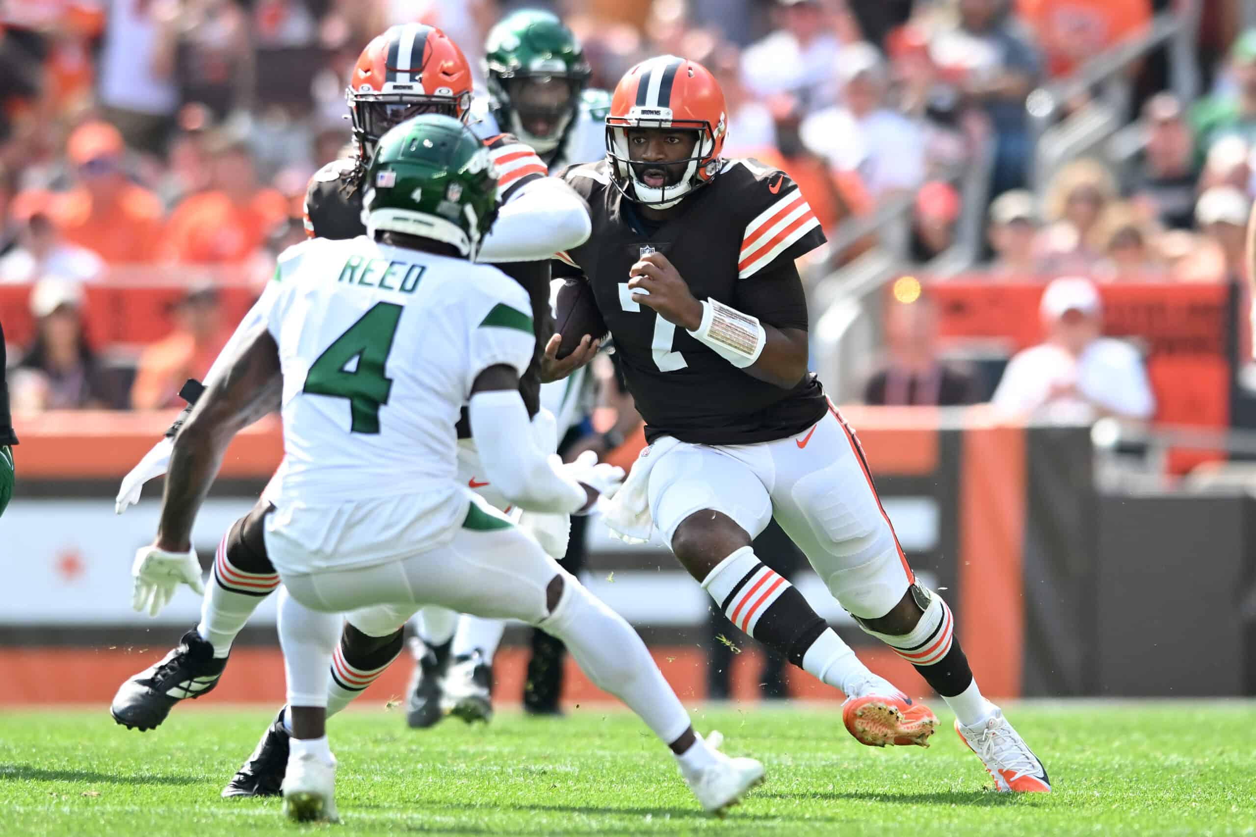 Jacoby Brissett #7 of the Cleveland Browns runs with the ball against the New York Jets during the first quarter at FirstEnergy Stadium on September 18, 2022 in Cleveland, Ohio.