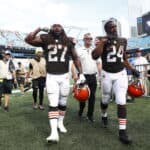 Kareem Hunt #27 of the Cleveland Browns and Nick Chubb #24 leave the field after defeating the Carolina Panthers at Bank of America Stadium on September 11, 2022 in Charlotte, North Carolina.