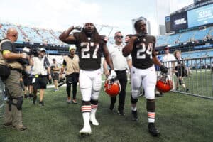 Kareem Hunt #27 of the Cleveland Browns and Nick Chubb #24 leave the field after defeating the Carolina Panthers at Bank of America Stadium on September 11, 2022 in Charlotte, North Carolina.