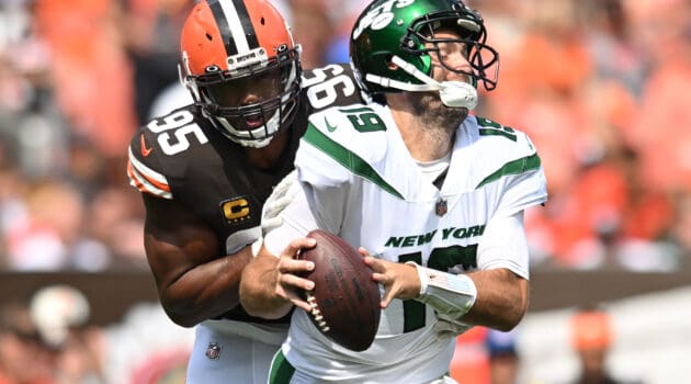 Myles Garrett #95 of the Cleveland Browns hits Joe Flacco #19 of the New York Jets during the second quarter at FirstEnergy Stadium on September 18, 2022 in Cleveland, Ohio.