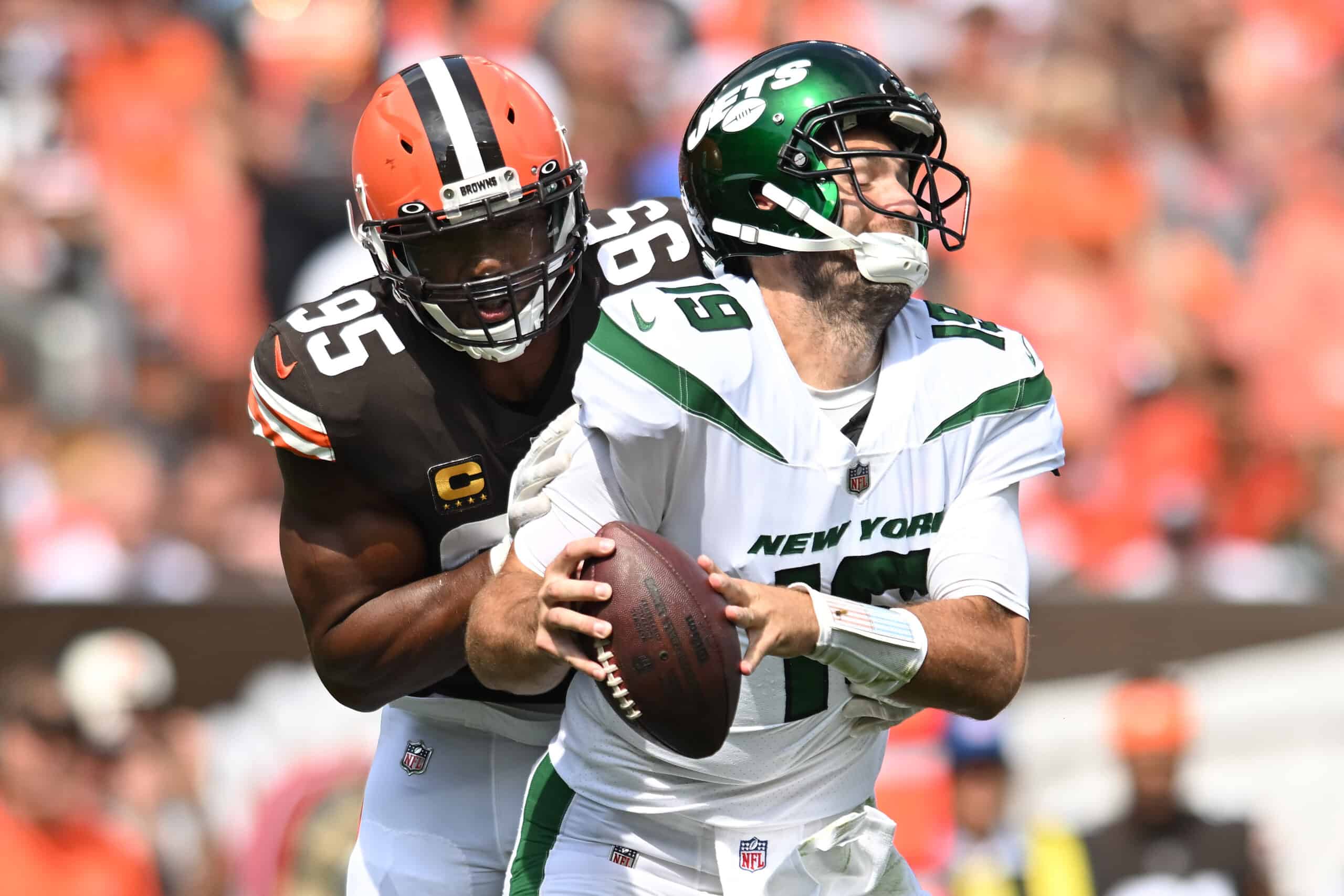 Myles Garrett #95 of the Cleveland Browns hits Joe Flacco #19 of the New York Jets during the second quarter at FirstEnergy Stadium on September 18, 2022 in Cleveland, Ohio.