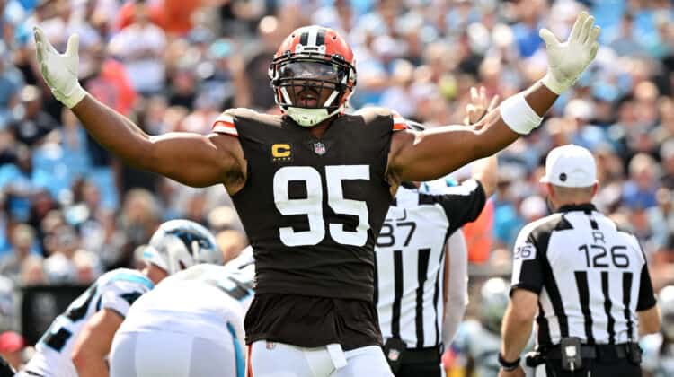 Myles Garrett #95 of the Cleveland Browns reacts after sacking Baker Mayfield #6 of the Carolina Panthers during the third quarter at Bank of America Stadium on September 11, 2022 in Charlotte, North Carolina.