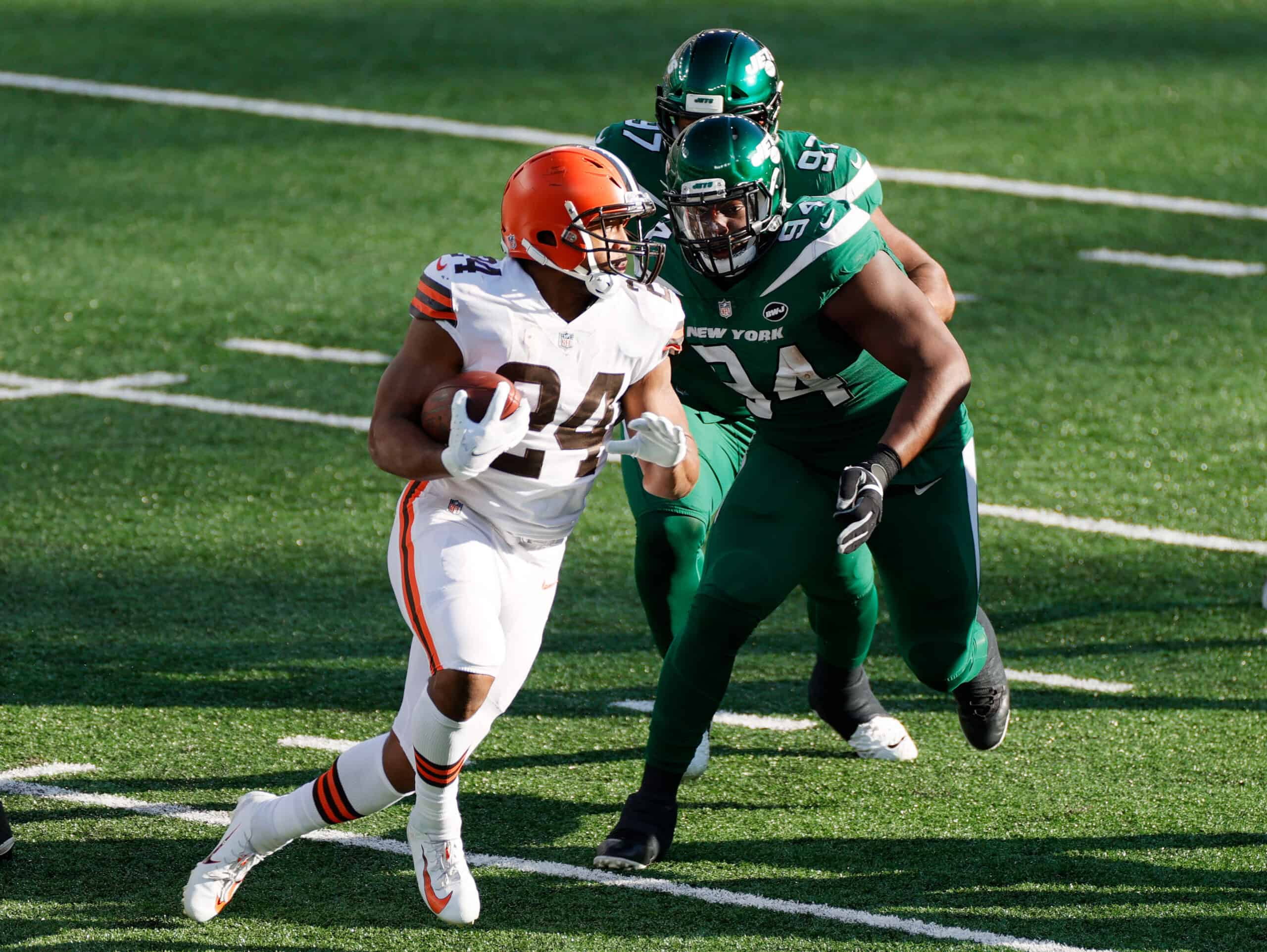 Nick Chubb #24 of the Cleveland Browns carries the ball against Foley Fatukasi #94 of the New York Jets in the second quarter at MetLife Stadium on December 27, 2020 in East Rutherford, New Jersey. 