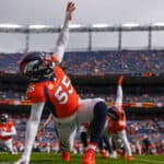 Bradley Chubb #55 of the Denver Broncos stretches during warmups before the game against the New York Jets at Empower Field At Mile High on October 23, 2022 in Denver, Colorado.