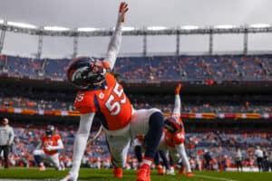 Bradley Chubb #55 of the Denver Broncos stretches during warmups before the game against the New York Jets at Empower Field At Mile High on October 23, 2022 in Denver, Colorado.