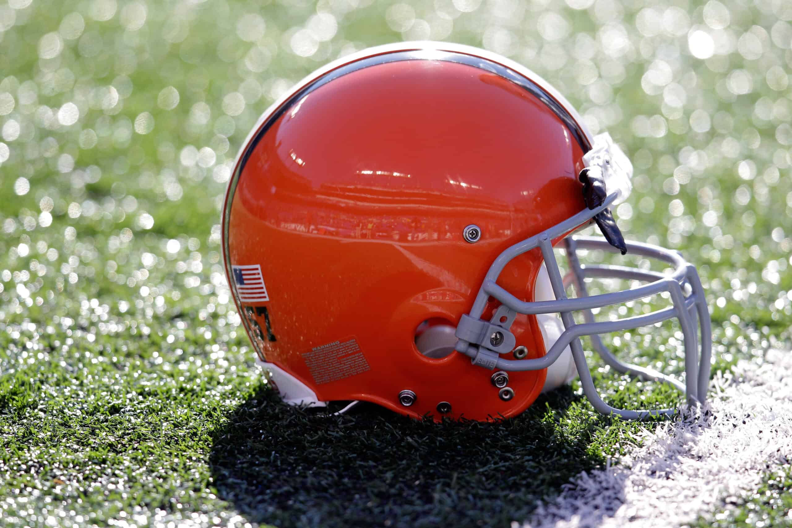 The helmet of  Christian Yount #57 of the Cleveland Browns sits on the turf before the start of the Browns and Baltimore Ravens game at M&T Bank Stadium on December 24, 2011 in Baltimore, Maryland. 