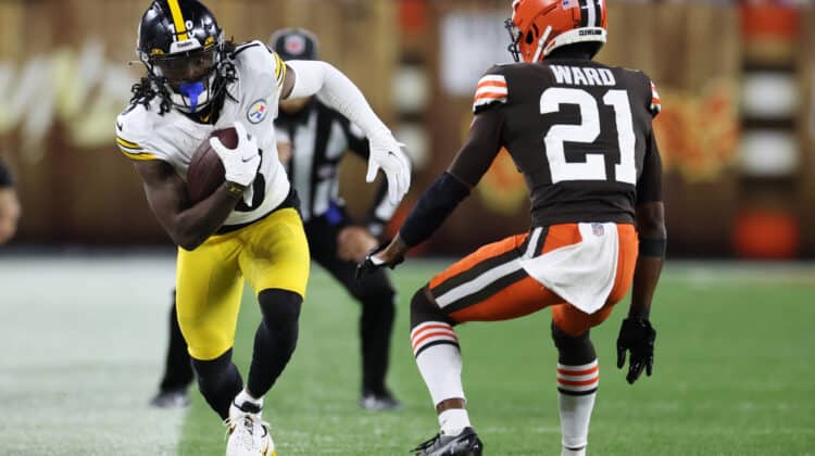 Diontae Johnson #18 of the Pittsburgh Steelers makes a reception ahead of Denzel Ward #21 of the Cleveland Browns during the third quarter at FirstEnergy Stadium on September 22, 2022 in Cleveland, Ohio