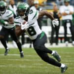Elijah Moore #8 of the New York Jets runs with the ball in the first quarter against the Pittsburgh Steelers at Acrisure Stadium on October 02, 2022 in Pittsburgh, Pennsylvania.