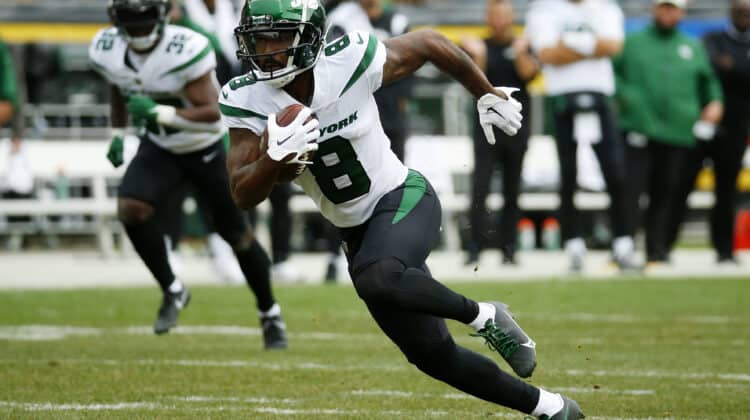 Elijah Moore #8 of the New York Jets runs with the ball in the first quarter against the Pittsburgh Steelers at Acrisure Stadium on October 02, 2022 in Pittsburgh, Pennsylvania.