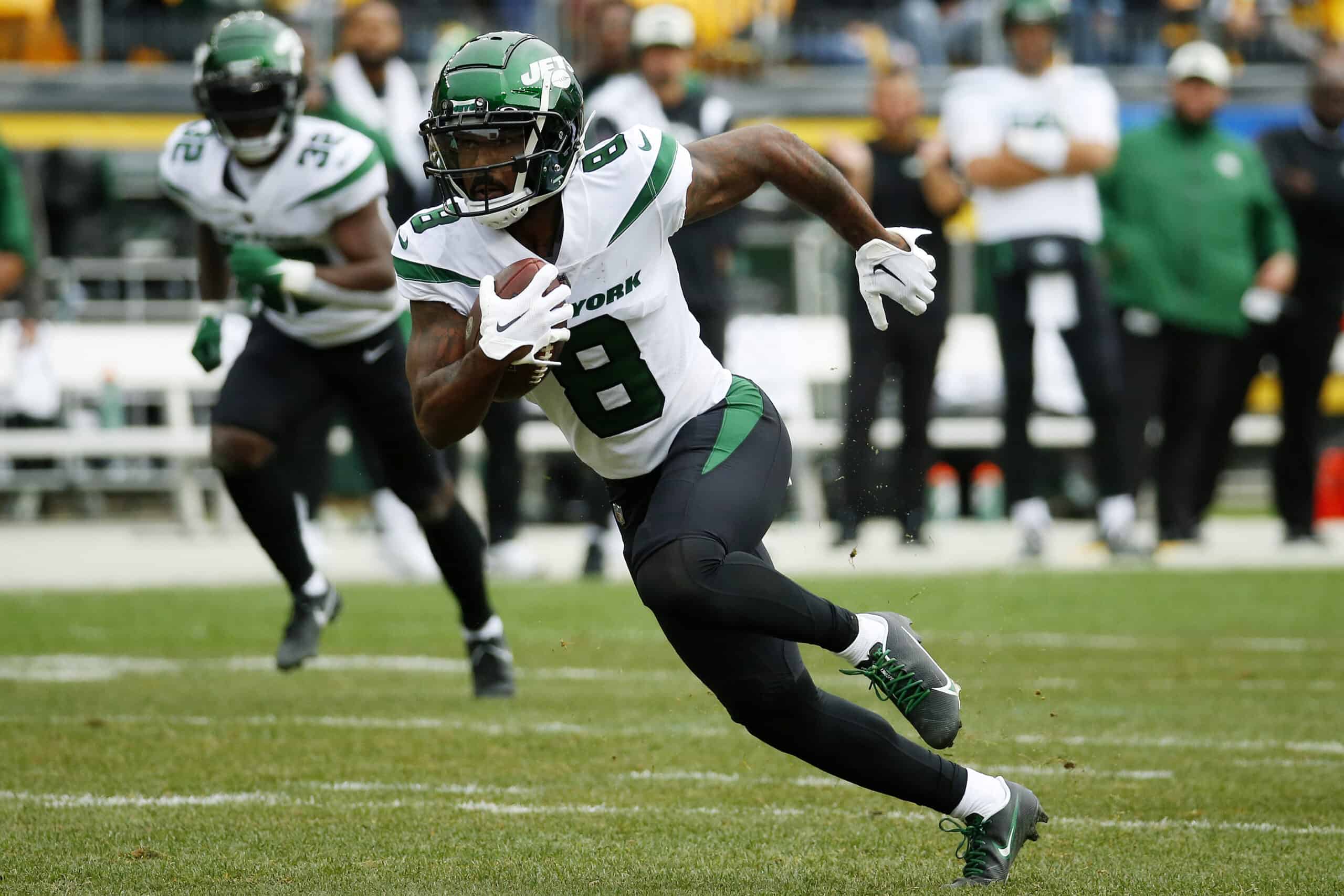 Elijah Moore #8 of the New York Jets runs with the ball in the first quarter against the Pittsburgh Steelers at Acrisure Stadium on October 02, 2022 in Pittsburgh, Pennsylvania. 