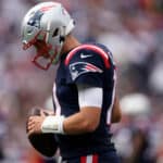 Mac Jones #10 of the New England Patriots looks on during the game against the Baltimore Ravens at Gillette Stadium on September 25, 2022 in Foxborough, Massachusetts.