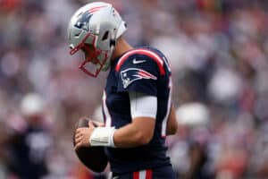 Mac Jones #10 of the New England Patriots looks on during the game against the Baltimore Ravens at Gillette Stadium on September 25, 2022 in Foxborough, Massachusetts.