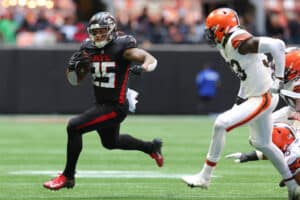 Tyler Allgeier #25 of the Atlanta Falcons runs with the ball against the Cleveland Browns during the fourth quarter at Mercedes-Benz Stadium on October 02, 2022 in Atlanta, Georgia.