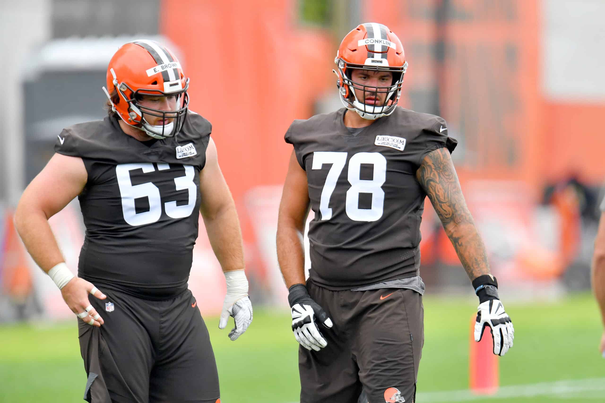 Evan Brown #63 and Jack Conklin #78 of the Cleveland Browns work out during training camp on August 16, 2020 at the Cleveland Browns training facility in Berea, Ohio.