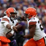 Quarterback Jacoby Brissett #7 hands the ball off to running back Nick Chubb #24 of the Cleveland Browns in the second half against the Baltimore Ravens at M&T Bank Stadium on October 23, 2022 in Baltimore, Maryland.