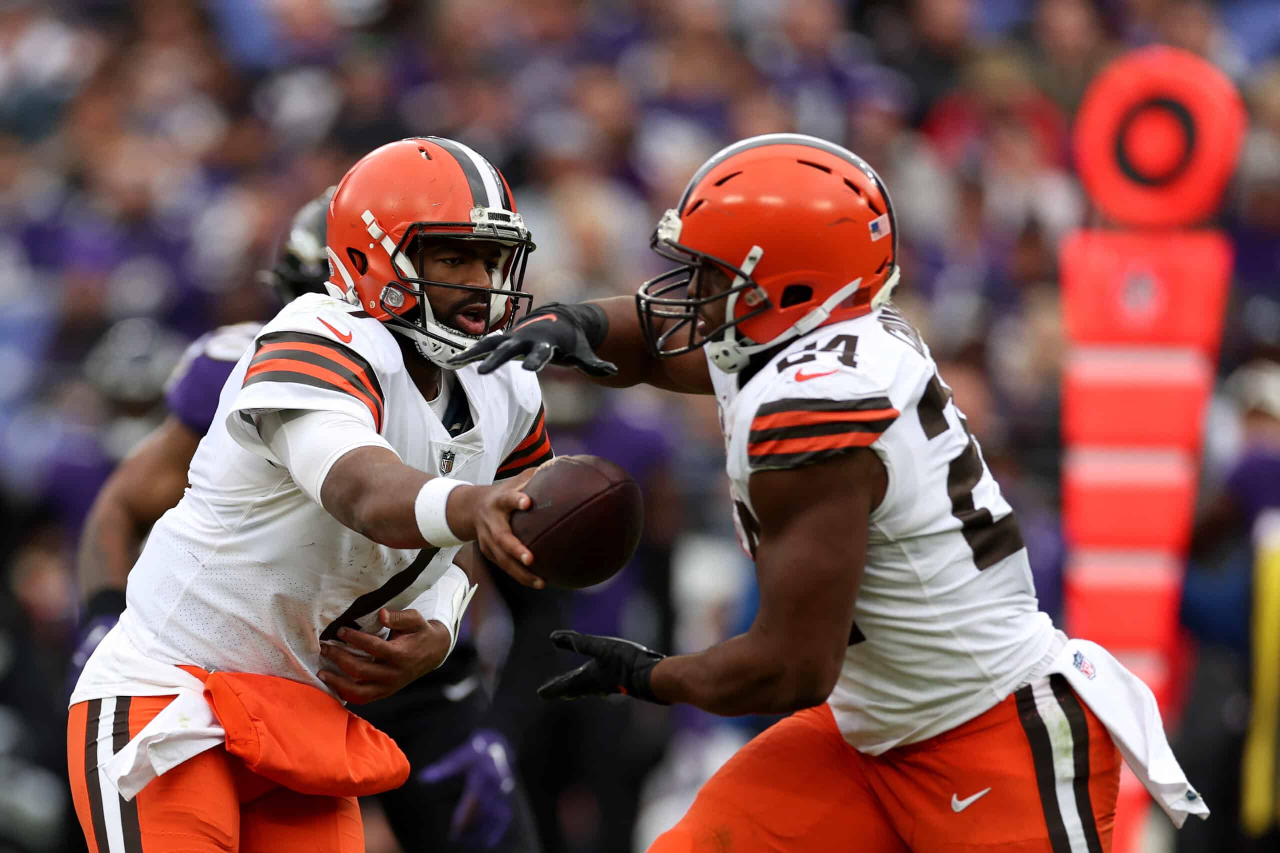 Quarterback Jacoby Brissett #7 hands the ball off to running back Nick Chubb #24 of the Cleveland Browns in the second half against the Baltimore Ravens at M&T Bank Stadium on October 23, 2022 in Baltimore, Maryland.