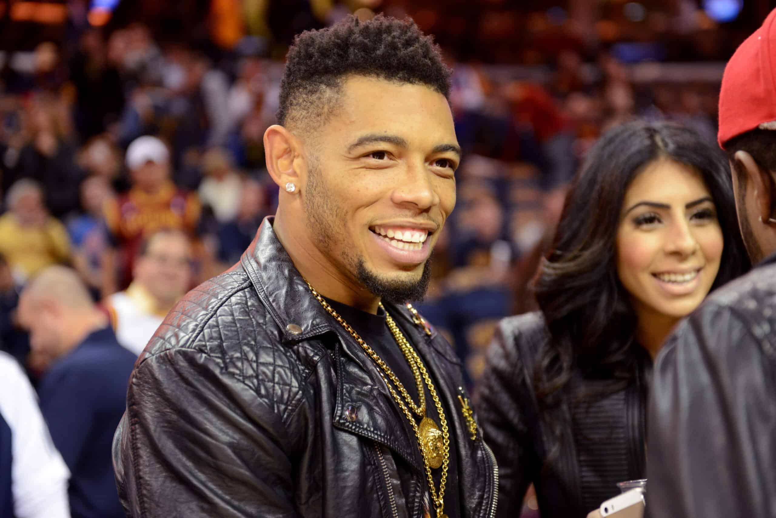 Joe Haden of the Cleveland Browns looks on from the crowd during a game between the Cleveland Cavaliers and the New York Knicks at Quicken Loans Arena on October 30, 2014 in Cleveland, Ohio. NOTE TO USER: User expressly acknowledges and agrees that, by downloading and or using this photograph, User is consenting to the terms and conditions of the Getty Images License Agreement.