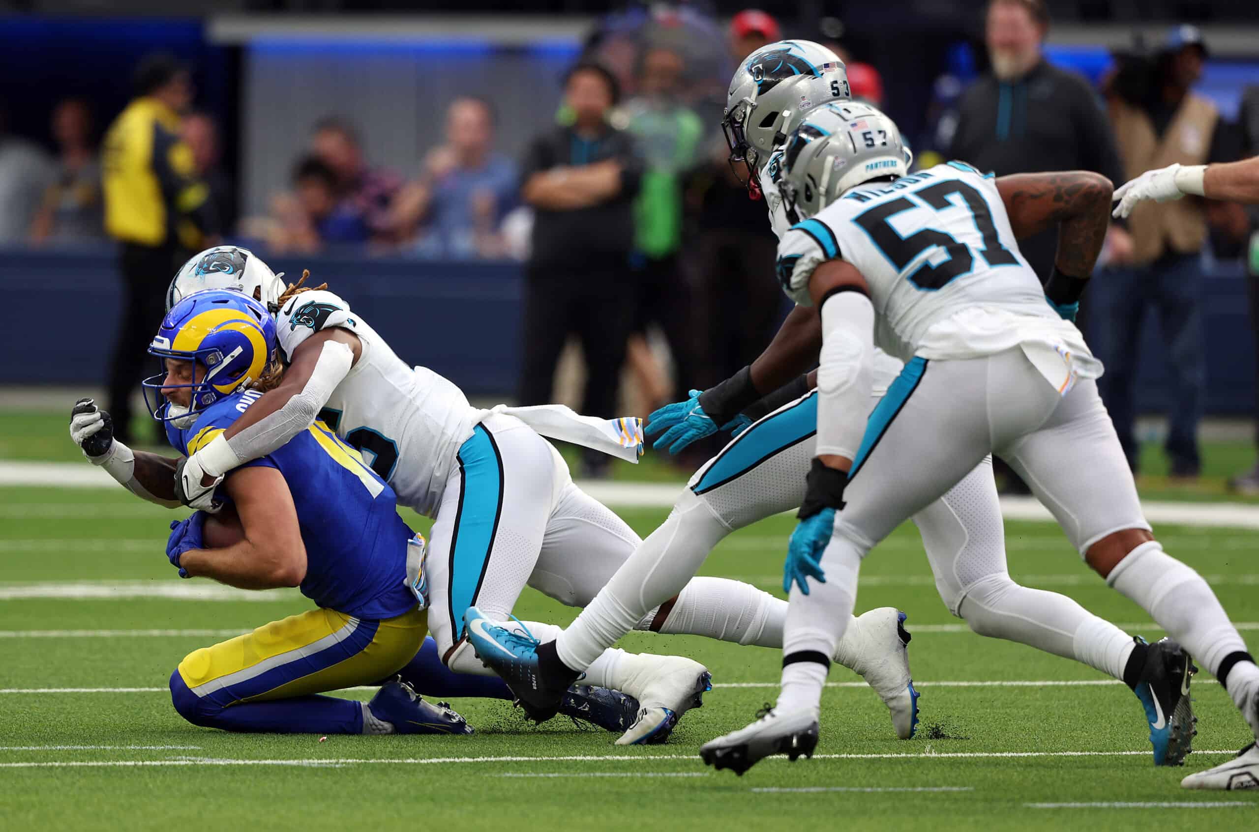 Ben Skowronek #18 of the Los Angeles Rams gets tackled by Arron Mosby #46 of the Carolina Panthers after a catch in the fourth quarter at SoFi Stadium on October 16, 2022 in Inglewood, California. 