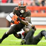 David Njoku #85 of the Cleveland Browns is tackled by the Tampa Bay Buccaneers during a game at FirstEnergy Stadium on November 27, 2022 in Cleveland, Ohio.