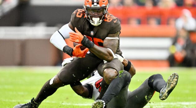 David Njoku #85 of the Cleveland Browns is tackled by the Tampa Bay Buccaneers during a game at FirstEnergy Stadium on November 27, 2022 in Cleveland, Ohio.