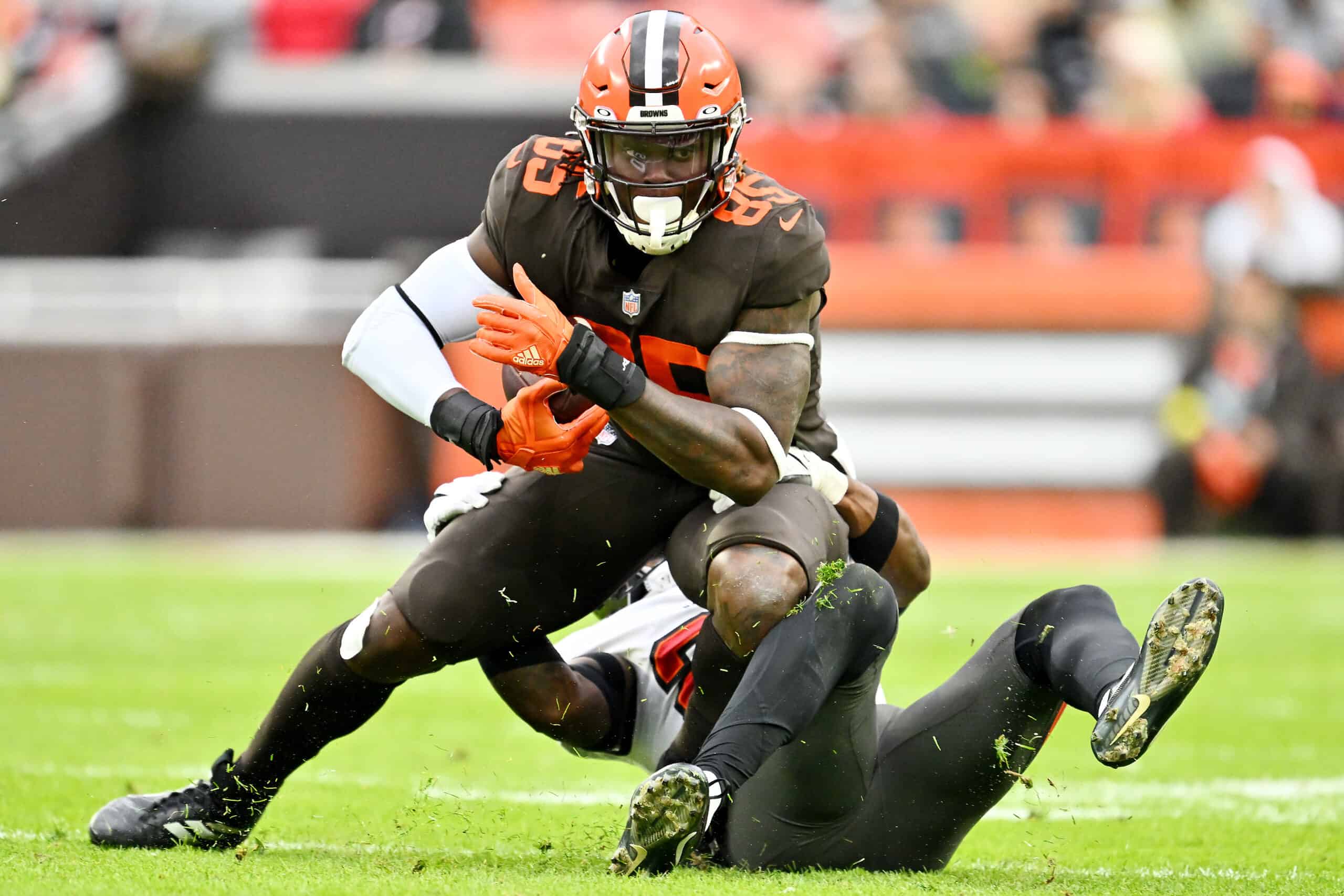 David Njoku #85 of the Cleveland Browns is tackled by the Tampa Bay Buccaneers during a game at FirstEnergy Stadium on November 27, 2022 in Cleveland, Ohio.