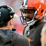 Jacoby Brissett #7 of the Cleveland Browns talks to head coach Kevin Stefanski during the first half against the Tampa Bay Buccaneers at FirstEnergy Stadium on November 27, 2022 in Cleveland, Ohio.