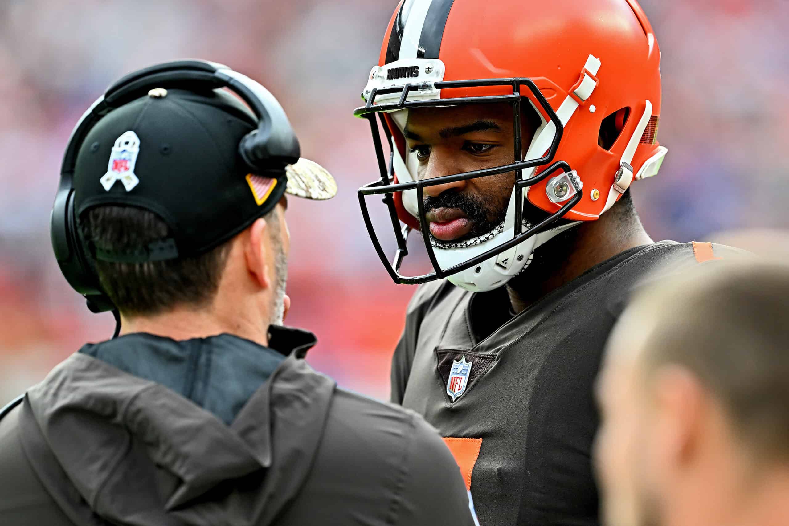 Jacoby Brissett #7 of the Cleveland Browns talks to head coach Kevin Stefanski during the first half against the Tampa Bay Buccaneers at FirstEnergy Stadium on November 27, 2022 in Cleveland, Ohio. 