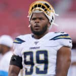 Jerry Tillery #99 of the Los Angeles Chargers looks on during pregame warm ups prior to the start of an NFL football game against the San Francisco 49ers at Levi's Stadium on August 29, 2019 in Santa Clara, California.