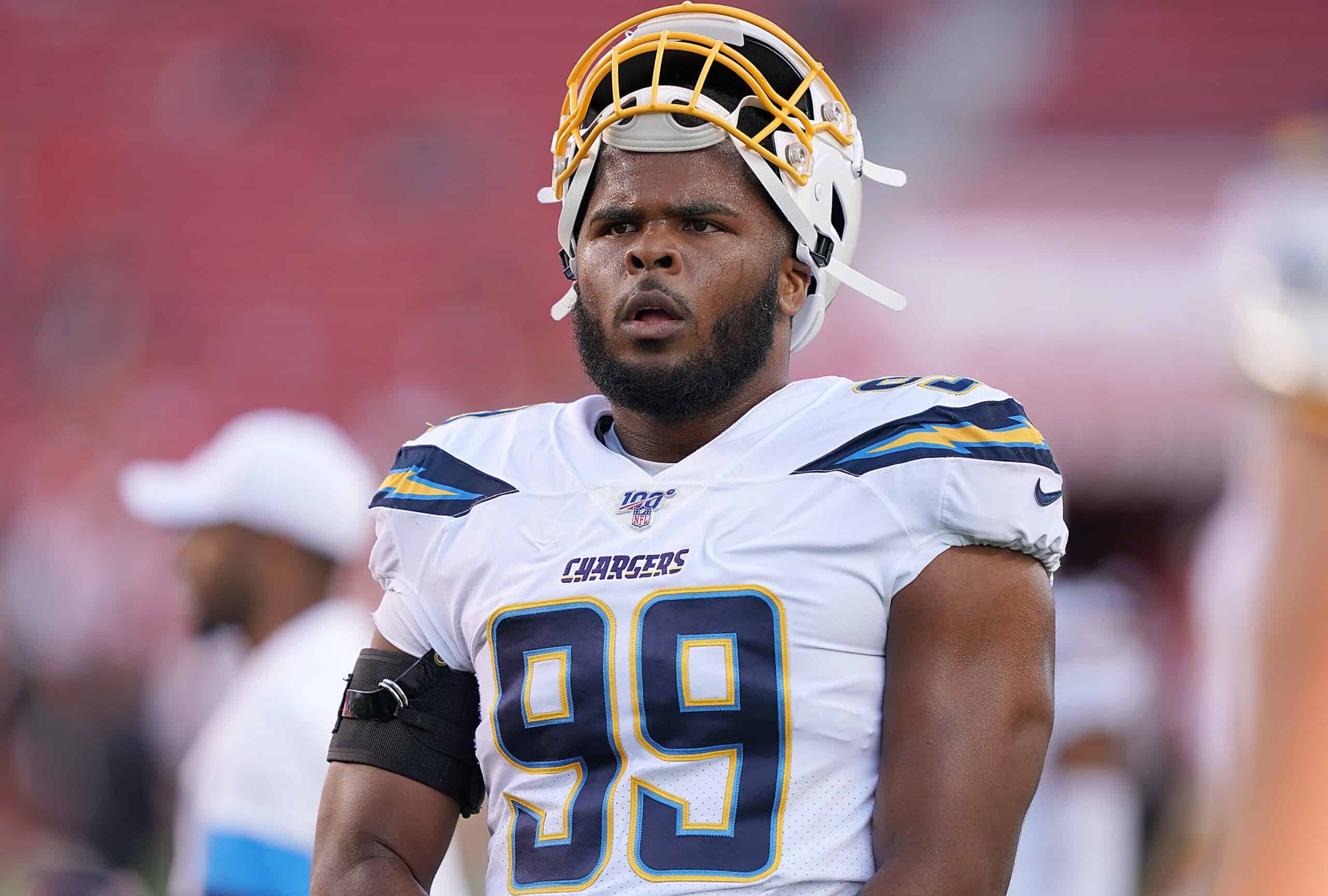 Jerry Tillery #99 of the Los Angeles Chargers looks on during pregame warm ups prior to the start of an NFL football game against the San Francisco 49ers at Levi's Stadium on August 29, 2019 in Santa Clara, California.