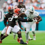 Raheem Mostert #31 of the Miami Dolphins rushes whilst being tackled by John Johnson III #43 of the Cleveland Browns in the second quarter of the game at Hard Rock Stadium on November 13, 2022 in Miami Gardens, Florida.