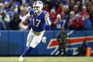 Josh Allen #17 of the Buffalo Bills runs during overtime against the Minnesota Vikings at Highmark Stadium on November 13, 2022 in Orchard Park, New York.