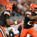 Jacoby Brissett #7 of the Cleveland Browns hands the ball off to Kareem Hunt #27 in the first half against the Cincinnati Bengals at FirstEnergy Stadium on October 31, 2022 in Cleveland, Ohio.