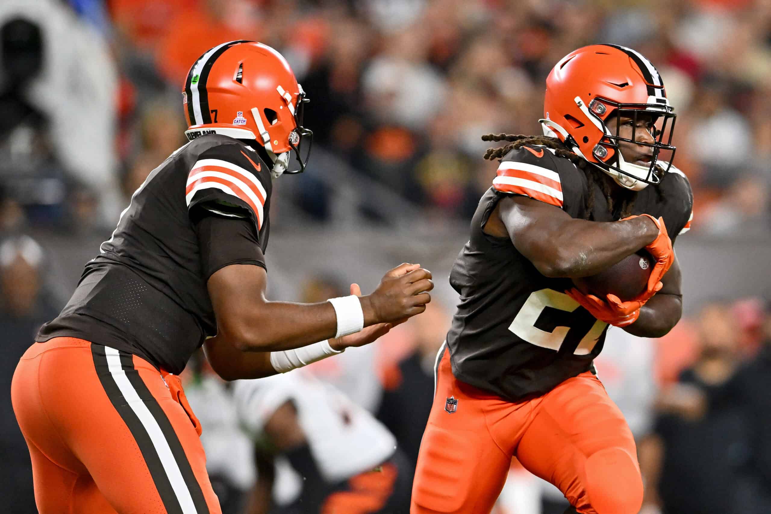 Jacoby Brissett #7 of the Cleveland Browns hands the ball off to Kareem Hunt #27 in the first half against the Cincinnati Bengals at FirstEnergy Stadium on October 31, 2022 in Cleveland, Ohio.