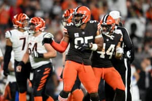 Myles Garrett #95 and Sione Takitaki #44 of the Cleveland Browns celebrate after a defensive play during the second half of the game against the Cincinnati Bengals at FirstEnergy Stadium on October 31, 2022 in Cleveland, Ohio.